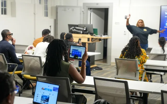 A classroom of attendees at a Grant Ready University session in the Baltimore Community Innovation Center, with Kayla Life presenting at the front